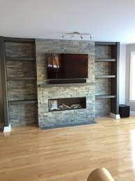 With the stone still removed from the fireplace, i drilled some holes to get more information about my. Television Above Valor Gas Fireplace With Stone Cladding Surround Modern Family Room Ottawa By The Fireplace Center And Patio Shop Houzz