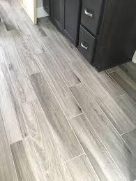 Newly Installed Gray Weathered Wood Plank Tile Flooring Mudroom Foyer Ideas Bathroom Ide Grey Wood Tile Apartment Bathroom Design Gray Wood Tile Flooring