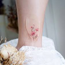 The symbol is a stylized piece of art created for the film. Watercolor Hakuna Matata Symbol Tattoo On The Ankle