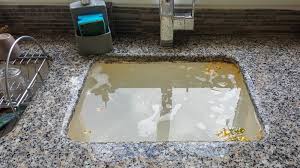 solve sink clogged from grease and food