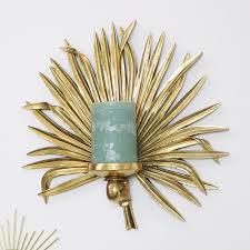These sconces can brighten a doorway or accent a favorite piece of wall art. Gold Palm Leaf Candle Wall Sconce