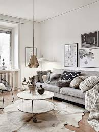Grey And Neutral Living Room With Gold Pendant Lamp Round Two Layered Coffee Table And Grey Couch Living Room Scandinavian Living Room Designs Room Interior