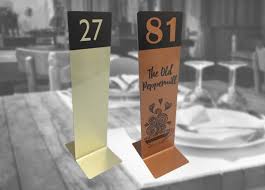White plastic cards with 2 3/4 in. Table Numbers Table Number Holders Table Signs