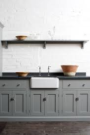 Create An Elegant Statement With A White Brick Wall Design Ideas Black Kitchen Countertops Loft Kitchen Grey Kitchen Cabinets