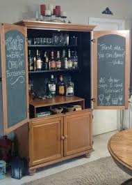 Home bar cabinets can be quite expensive. An Old Armoire Turned Into A Bar Did This Project As A Gift For My Husband He Loves It Diy Home Bar Armoire Bar Armoire Repurpose
