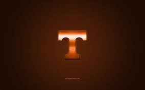 The tennessee volunteers logo font is goudy oldstyle standard. Download Wallpapers Tennessee Volunteers Logo American Football Club Ncaa Orange Logo Orange Carbon Fiber Background American Football Knoxville Tennessee Usa Tennessee Volunteers University Of Tennessee Athletics For Desktop Free Pictures