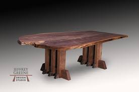 This modern coffee table is made from one single slab of wood. Three Column Live Edge Coffee Table Jeffrey Greene