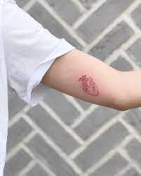 Tiny Red Heart Tattoo By Loz Thomas Tattooed On The Left Arm Red Heart Tattoo Tattoos Butterfly Tattoos For Women