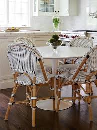 Fabulous Eat In Kitchen Features A Marble Saarinen Dining Table Lined With Black And White French Bistro Bistro Chairs Dining Table Marble French Bistro Chairs