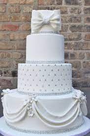 Modern custom four tier square wedding cake with grey and silver scattered pearls. Wedding Cakes Alliance Bakery