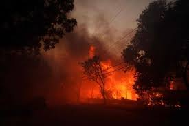 Wildfire sparks panicked evacuations in ...