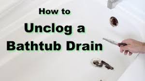 Feed a drain snake down the overflow hole. How To Unclog A Bathtub Drain In 10 Minutes Or Less
