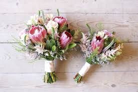 23 Beautiful Wedding Bouquets For Winter Brides Weddingsonline Protea Wedding Protea Bouquet Small Wedding Bouquets