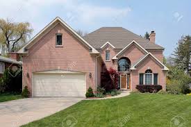 1.93mb, suburban brick house with flowers and. Suburban Brick Home With Arched Window Above Entry Stock Photo Picture And Royalty Free Image Image 33458574