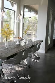 This modern farmhouse kitchen features a beautiful combination of navy blue painted and gray shelves and a set of apothecary drawers help house an assortment of baking tools, ingredients, mixing bowls and cookbooks. Hill Country Homebody Modern Dining Room Set Rustic Dining Room Farmhouse Dining