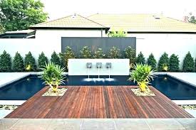 Example of a large trendy courtyard concrete paver and rectangular lap pool design in dallas Modern Small Backyards Novocom Top