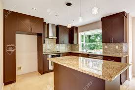 Its neutral color makes it blend in with. Modern Kitchen Room With Matte Brown Cabinets Shiny Granite Stock Photo Picture And Royalty Free Image Image 31999667
