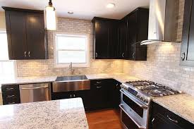 Stainless Steel Farmhouse Sink With White Granite And Dark Kitchen Cabinets Trendy Farmhouse Kitchen Farmhouse Sink Kitchen Stainless Steel Kitchen Cabinets
