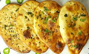 Combine the yeast, sugar, warm water, yogurt and 2 tablespoons of melted butter in a large bowl. Tandoori Naan In An Air Fryer And Oven Best Homemade Naan Recipe Instant Pot Chili Cheese Naan Recipe Aaichi Savali