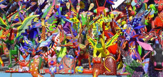 Alebrijes are brightly coloured, fantastical creatures, carved from copal wood and decorated in extremely detailed paintwork. Alebrijes September Celebration Our 30 Favorite Things About Mexico Livepuntamita Com