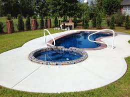In this section of our website, we will help you plan out the pool of your whether you want to build a small pool or a luxurious pool spa combo, get all the inspiration you need from our idea guide. Fiberglass Pool Spa Combination With Paver Coping Stone And Mosaic Tile Parrot Bay Pools Nc