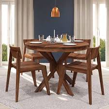 Wooden chairs and tables provide maximum comfort for daily use and they won't show regular wear and tear easily. Liana Gordon 4 Seater Round Dining Table Set Urban Ladder