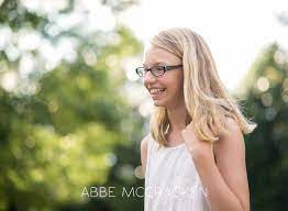 Candid portrait of a young tween girl with sparkly bokeh in background -  Charlotte NC Family Photographer | Joyful Childrens and Senior Photography