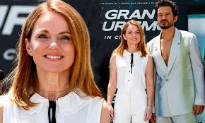 Geri Horner poses with her Gran Turismo co-star Orlando Bloom at photocall 