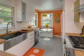 Adding a few shelves above your kitchen sink, or even on the side of your cabinets is a very modern. The Case For The Midcentury Modern Kitchen Layout