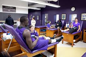 Student Athletes In The Uw Athletics Training Room Athletic Training Athletic Training Student Athletic Training Sports Medicine