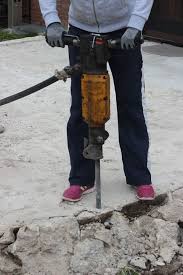 Breaking Up A Concrete Slab Such As An Old Concrete Patio Or Driveway Is Not A Task You Should Enter Into Lightly It Concrete Slab Broken Concrete Concrete