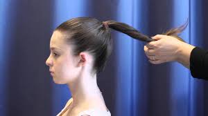 For any shorter pieces of hair in the back, use bobby pins to hold them up. How To Put Your Hair In A Bun Youtube
