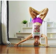 Lotus Pose Tripod Headstand With One Arm Extended Out On Finger Tips Yoga Photoshoot Handstand Yoga Stretches