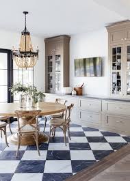 A sparse and simple dining room in a bright farmhouse by septembre architecture. 37 Charming French Country Dining Rooms