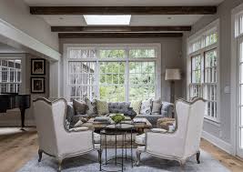 Contemporary living room in london with white walls, medium hardwood flooring and grey floors. Beautiful Gray Living Room Ideas