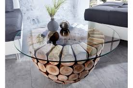 Faite pour des repas informels en famille ou pour des apéritifs dînatoires entre amis, elle peut aussi servir à exposer des livres, des revues ou des objets choisis. Table Basse Ronde Originale Bois Et Verre Pour Salon