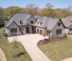 There are many benefits to lime washing verses painting your brick exterior. Beautiful European Style Custom Home Love The Beige Painted Brick With Wood Accents House Exterior Craftsman Style House Plans Luxury Homes Exterior