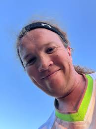 Three reds spotted at the bin opposite the caged football pitch