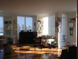 A Gallery Wall Around Windows In A Nyc Apartment Hallway Wall Decor Farmhouse Decor Living Room Gallery Wall