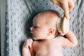 Brush your baby's scalp gently combing, brushing, or massaging baby's scalp can also stimulate hair growth. Mother Softly Brushing Hair Of Newborn Baby Girl On Changing Table Stock Images Page Everypixel