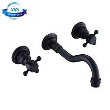 Wall mount bathroom faucets are installed on the wall behind the sink. Black Bathtub Faucet Brass Dual Handle Bath Shower Faucets Wall Mounted Bathroom Cabinet Tap Mixer 3296 Buy Dual Handle Bathtub Faucets Bathtub Faucet In Black And In Antique Bathroom Cabinet Tap Product