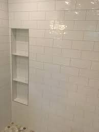 Cut & install modern trim for a shower niche. Bathroom Shower Niche With Schluter Chrome Trim Shower Niche Bathroom Redesign Bathroom Niche