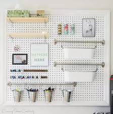 A home office & crafting room for a graphic designer is dominated by a unique lighting fixture. Craft Room Storage And Organization Ideas For Every Budget