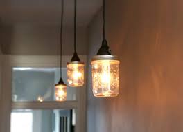 How To Make A Lighting Fixture Out Of Mason Jars Ehow Com Mason Jar Lighting Mason Jar Pendant Light Rustic Track Lighting