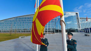 Знаме на северна македонија) depicts a stylized yellow sun on a red field, with eight broadening rays extending from the center to the edge of the field. North Macedonia Hoists Flag At Nato Headquarters European Western Balkans