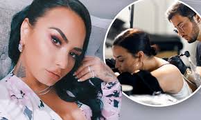 And by loves, i mean loooves, y'all. Demi Lovato Debuts New Butterfly Neck Tattoo And Possible New Song Lyrics Daily Mail Online