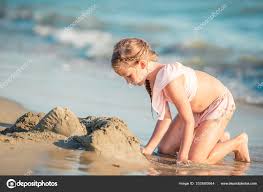 Little adorable girl playing on beach with ball — Stock Photo © d.travnikov  332600664