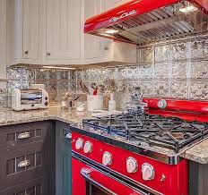 Tin Tile Style Backsplash With Big Chill Red Stove And Gray And White Cabinets Love The Color Combo Retro Kitchen Appliances Retro Kitchen Kitchen Decor