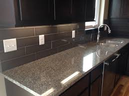 Backsplash installers in miami specialize in installing tile, stone or glass backsplashes. Kitchen Backsplash In A 4x16 Dark Subway Style Tile Kitchen Renovation Kitchen Design Kitchen Backsplash Inspiration