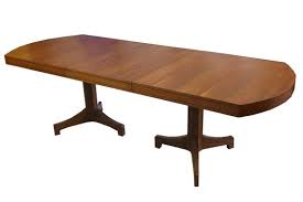 This wooden table has a square extension table top in a beautiful walnut finish. Heritage Robert A Walnut Extendable Dining Table Mutualart